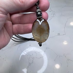 Dragon’s vein agate with hematite and silver finishings on faux leather cord